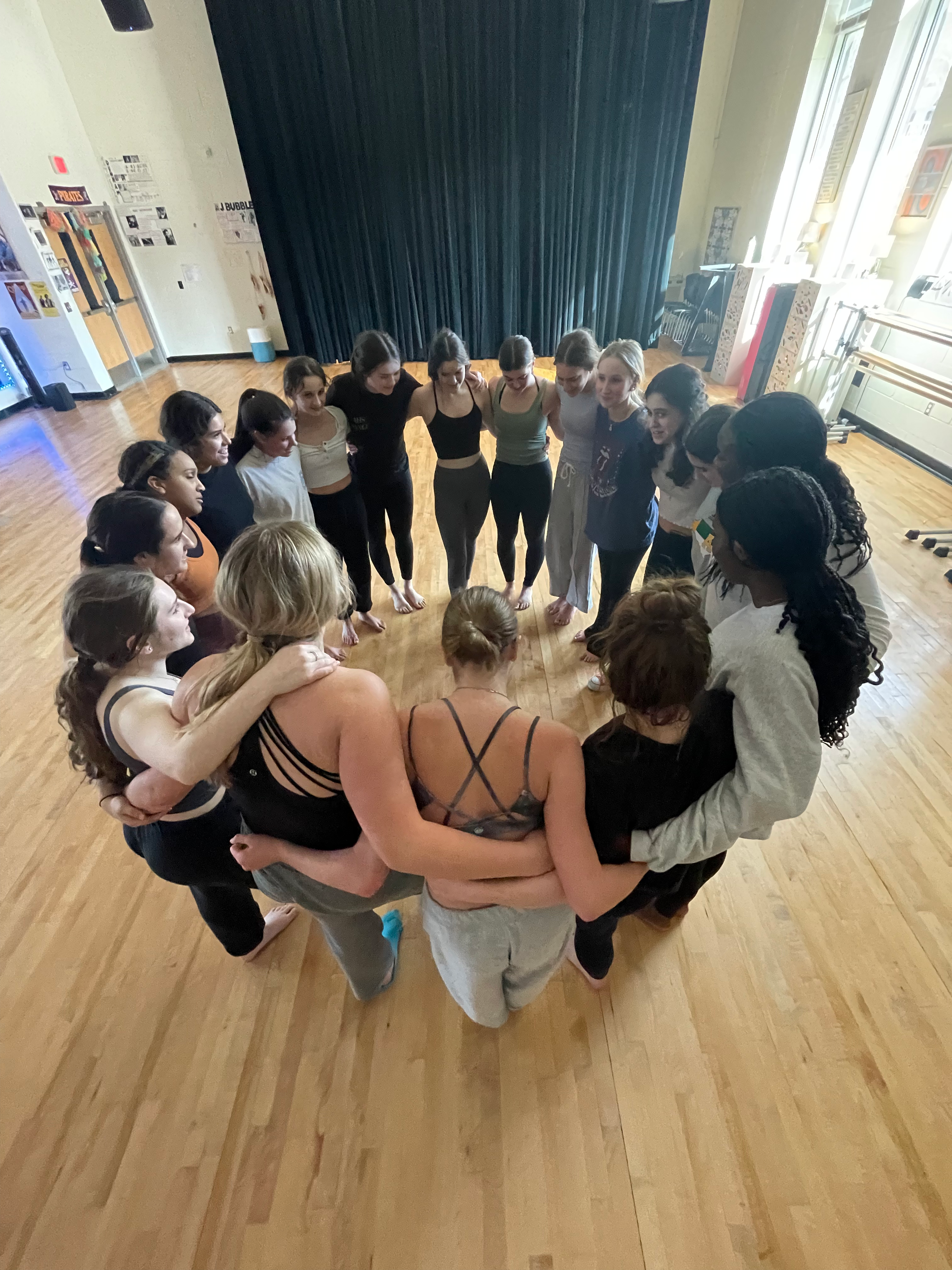 dancers supporting one another in the school studio